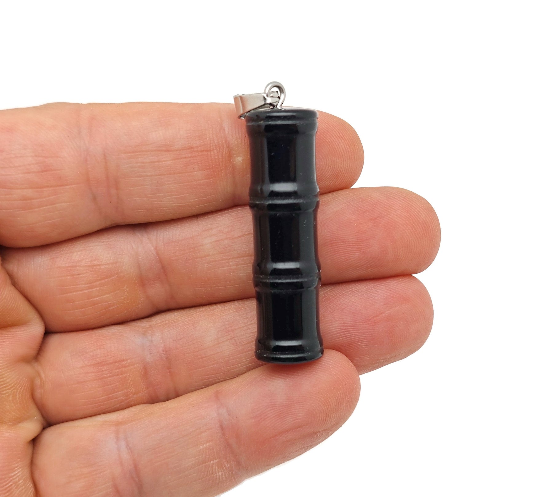 Obsidian bamboo-shaped crystal pendant from GemstoneGO featuring protective black obsidian gemstone.