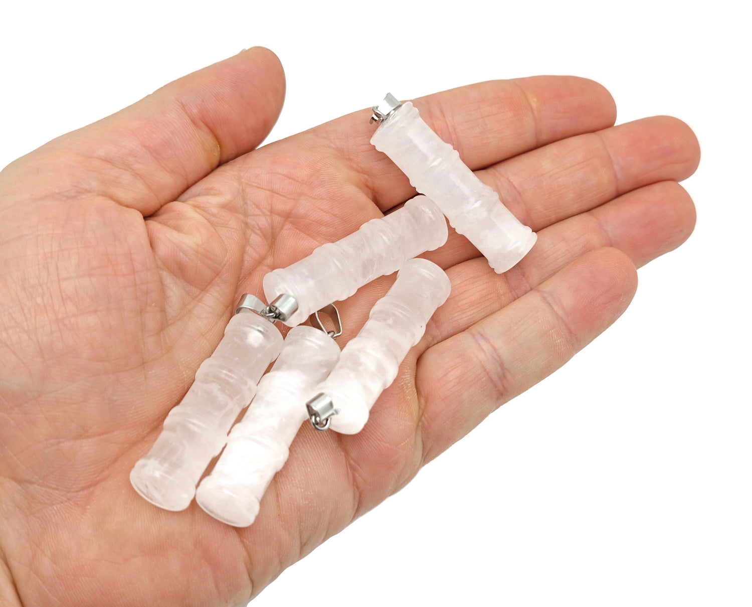 Clear quartz bamboo-shaped crystal pendant from GemstoneGO, showcasing a protective healing crystal with intricate bamboo detailing.