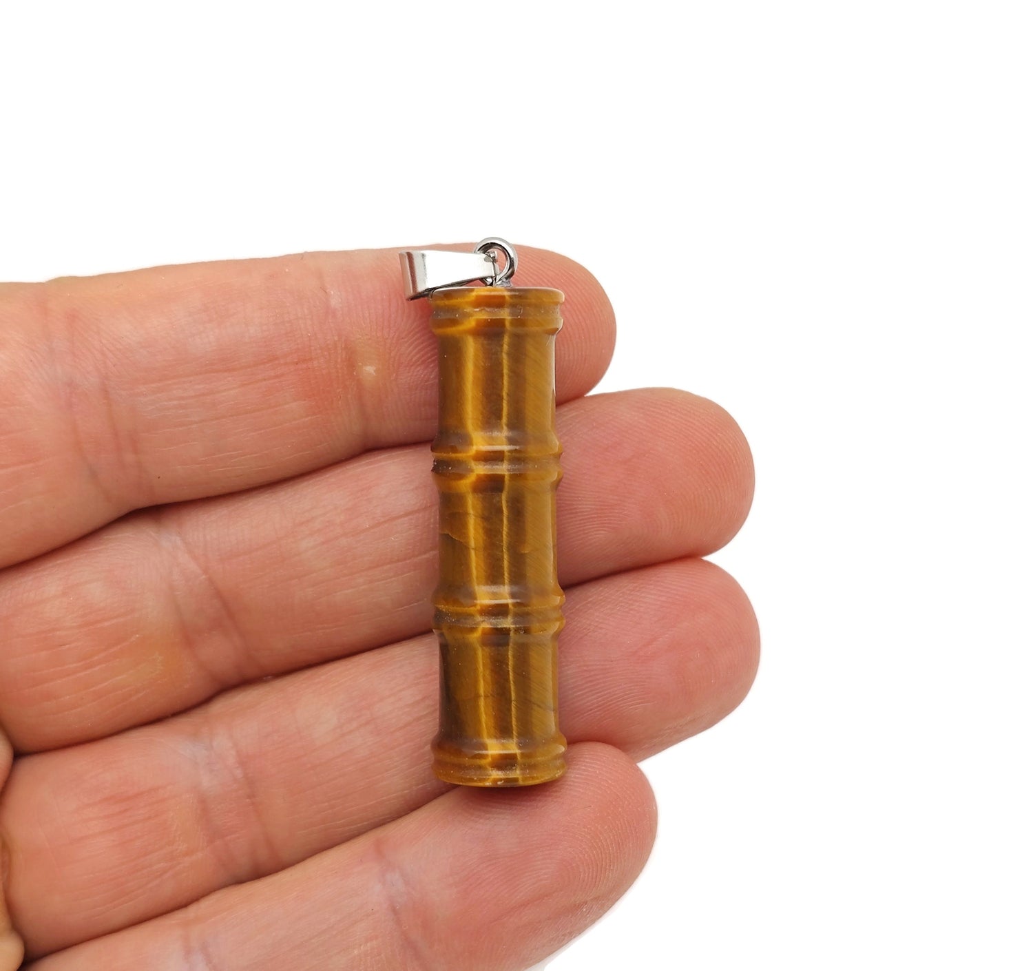 Tiger Eye bamboo-shaped crystal pendant from GemstoneGO, featuring a protective tiger eye gemstone in a bamboo design.