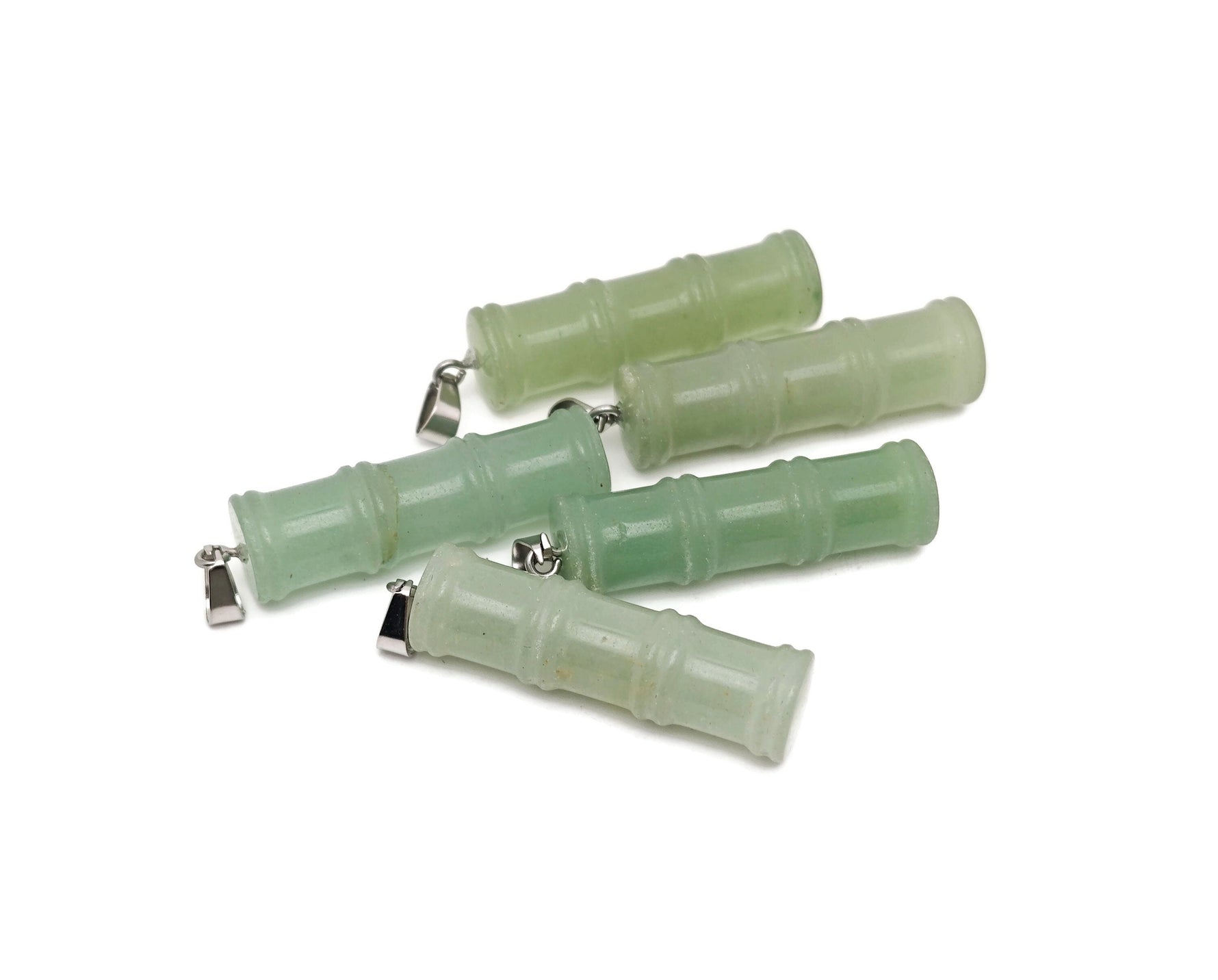 Aventurine bamboo-shaped crystal pendant from GemstoneGO, featuring a protective aventurine crystal on a silver chain.
