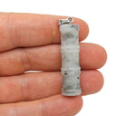 Labradorite bamboo-shaped crystal pendant from GemstoneGO featuring protective gemstone design and natural labradorite hues.
