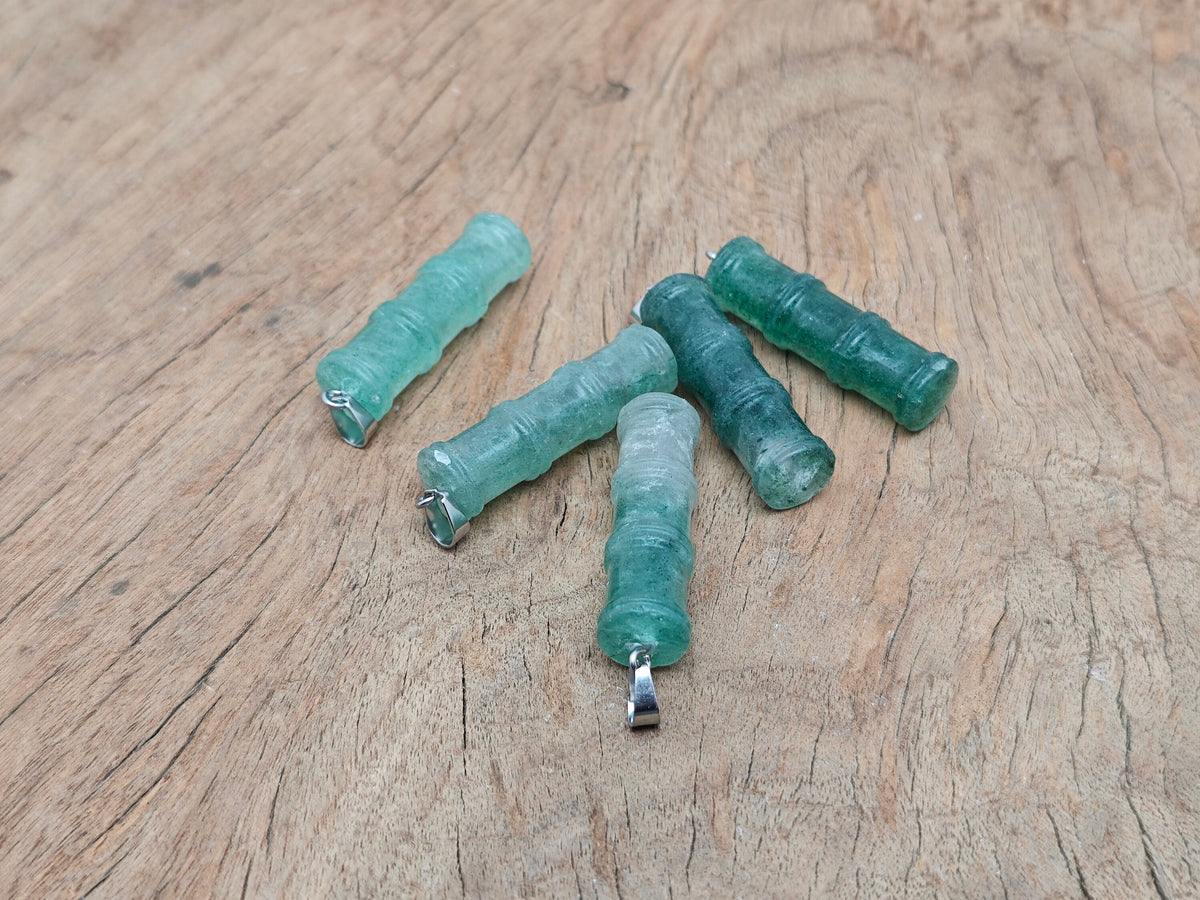 Green strawberry quartz bamboo-shaped crystal pendant from GemstoneGO, featuring a protective, vibrant green gemstone design.