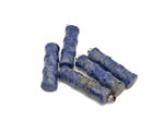 Sodalite bamboo-shaped crystal pendant from GemstoneGO with protective properties, showcasing blue and white stone details.