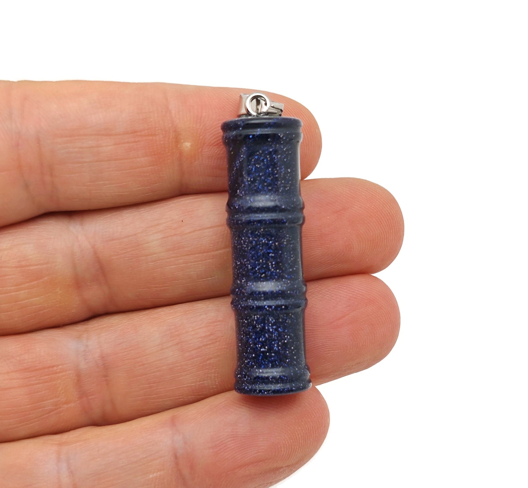 Blue Goldstone bamboo-shaped crystal pendant from GemstoneGO featuring a protective crystal design and vibrant blue color.