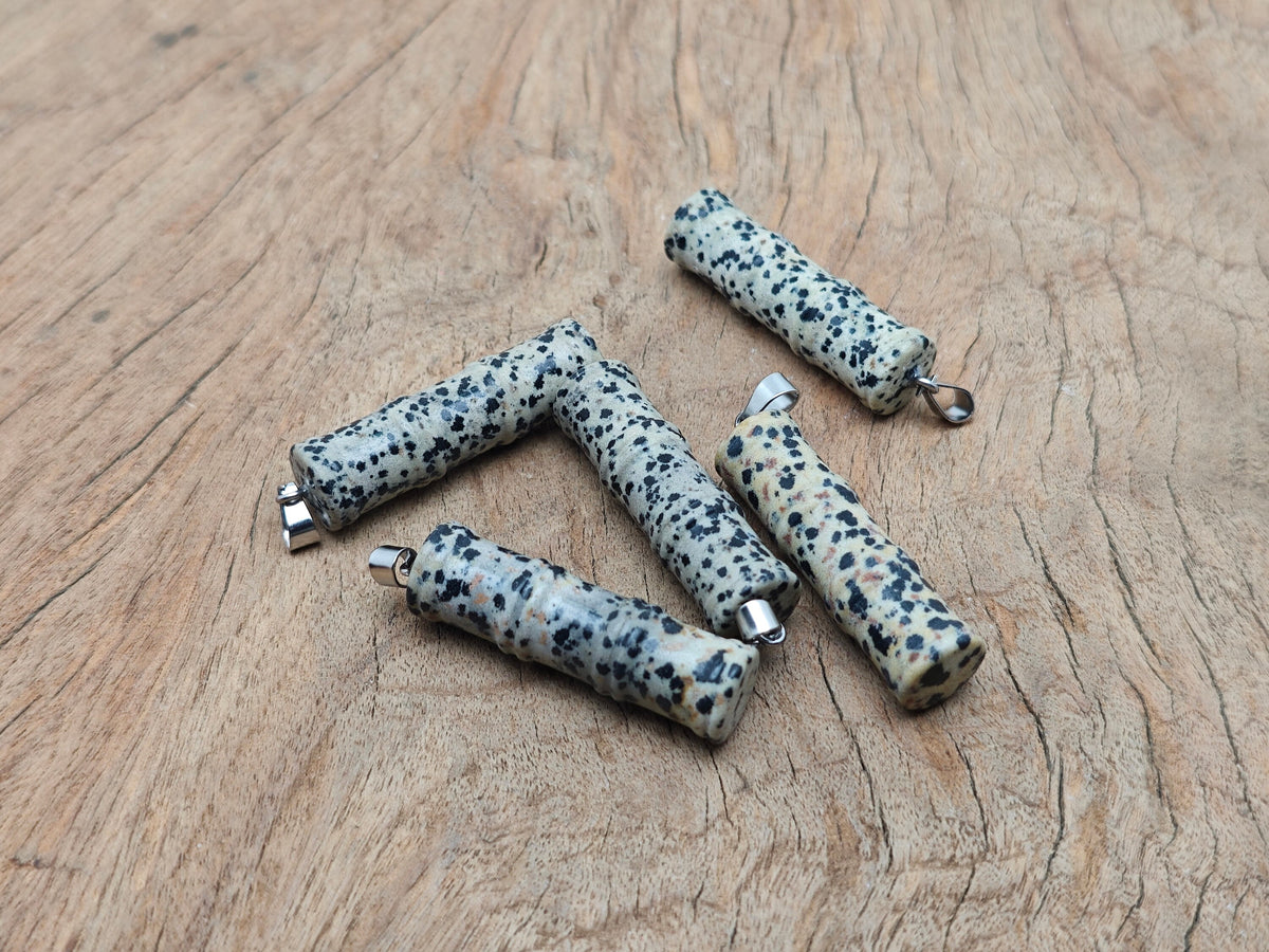 Dalmatian Jasper crystal pendant in bamboo shape, featuring protective gemstone design from GemstoneGO.