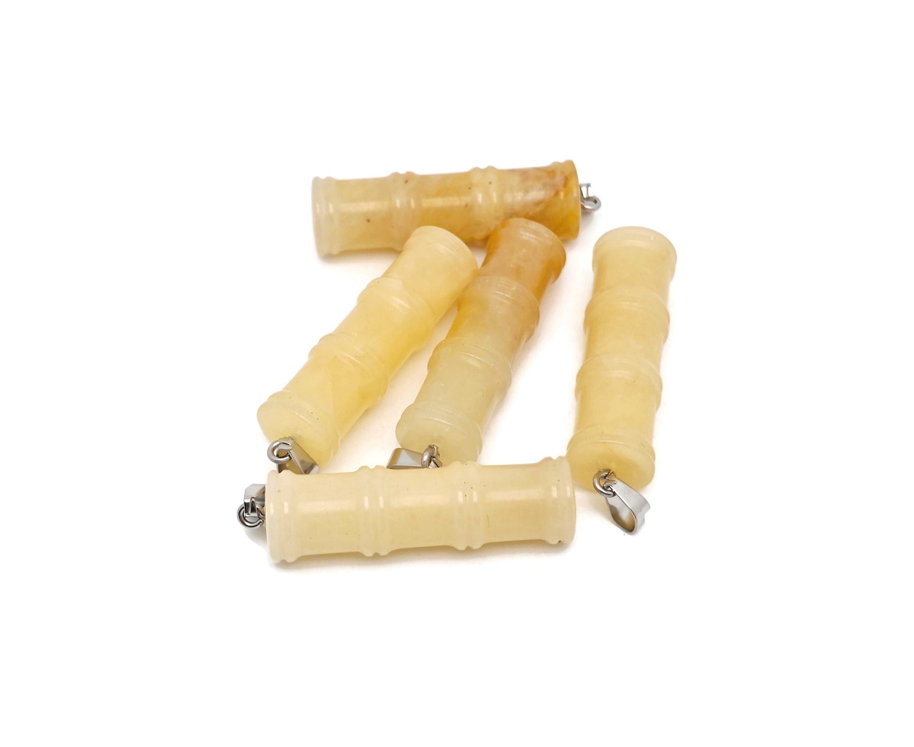 Yellow jade bamboo-shaped crystal pendant from GemstoneGO, featuring a protective crystal design on a silver chain.