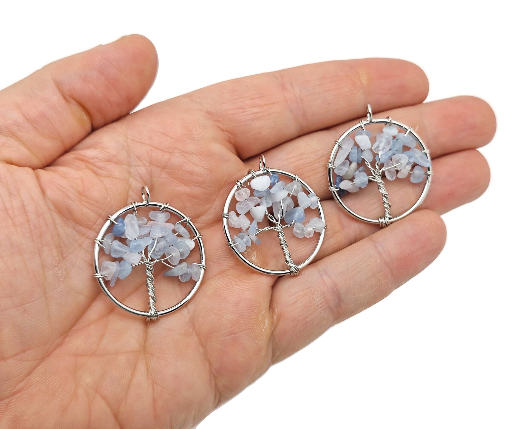 Handmade Tree of Life gemstone pendant with colorful crystals, featuring intricate crystal tree design for healing jewelry.