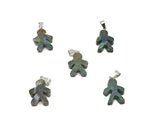 Moos Agate gingerbread cookie-shaped crystal pendant from GemstoneGO featuring mineral specimen with earthy tones and detailed design.