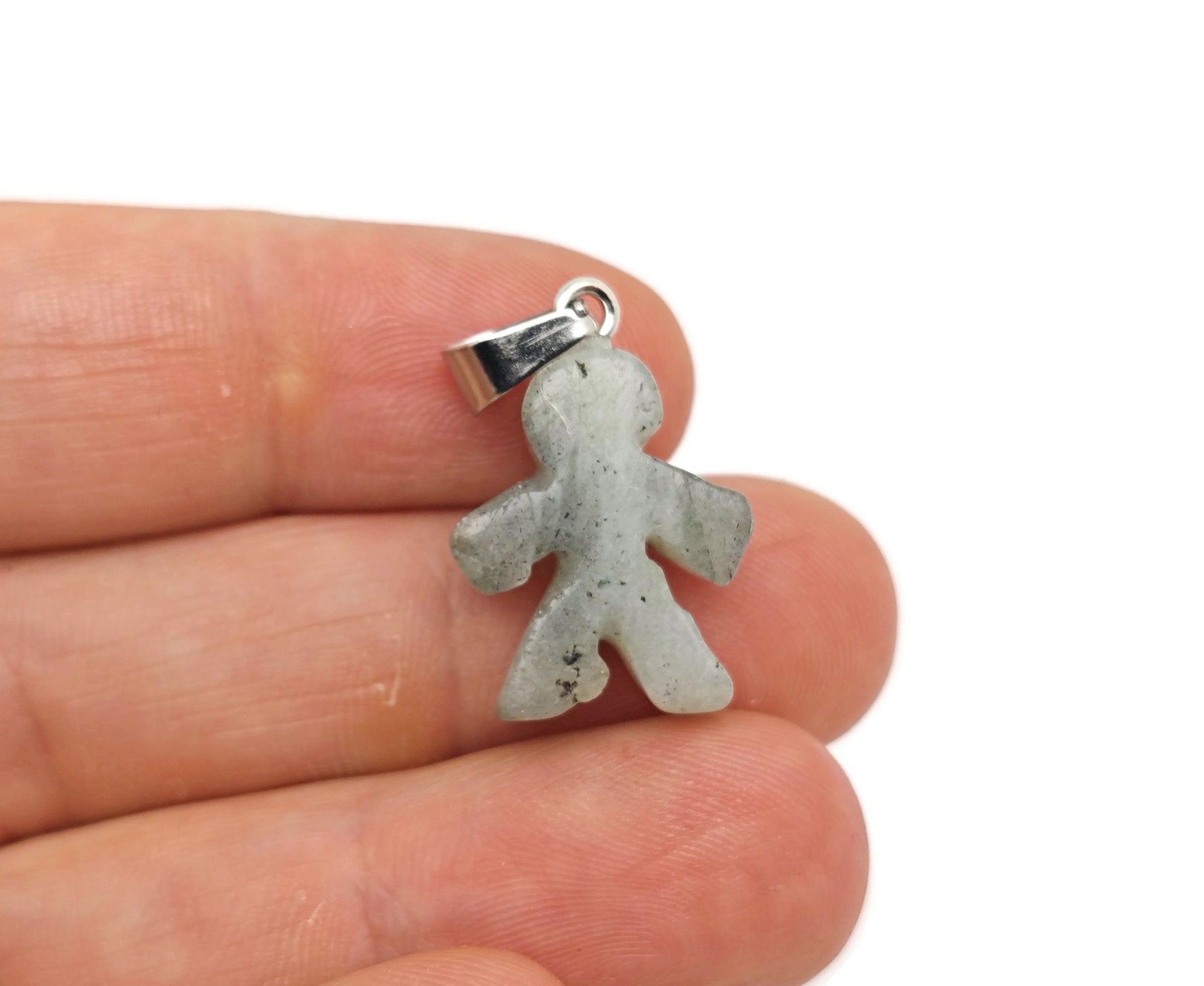 Labradorite gingerbread-shaped crystal pendant from GemstoneGO featuring mineral specimen details on a black background.