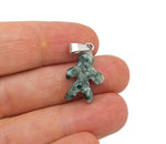 Green jade gingerbread cookie-shaped pendant with crystal accents, featuring a green dot design, crafted from Qinghai jade.