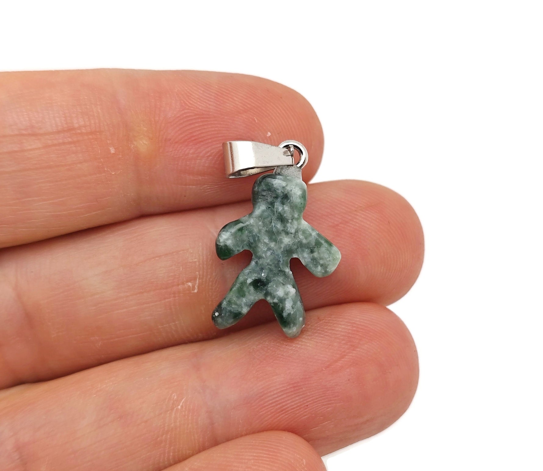 Green jade gingerbread cookie-shaped pendant with crystal accents, featuring a green dot design, crafted from Qinghai jade.
