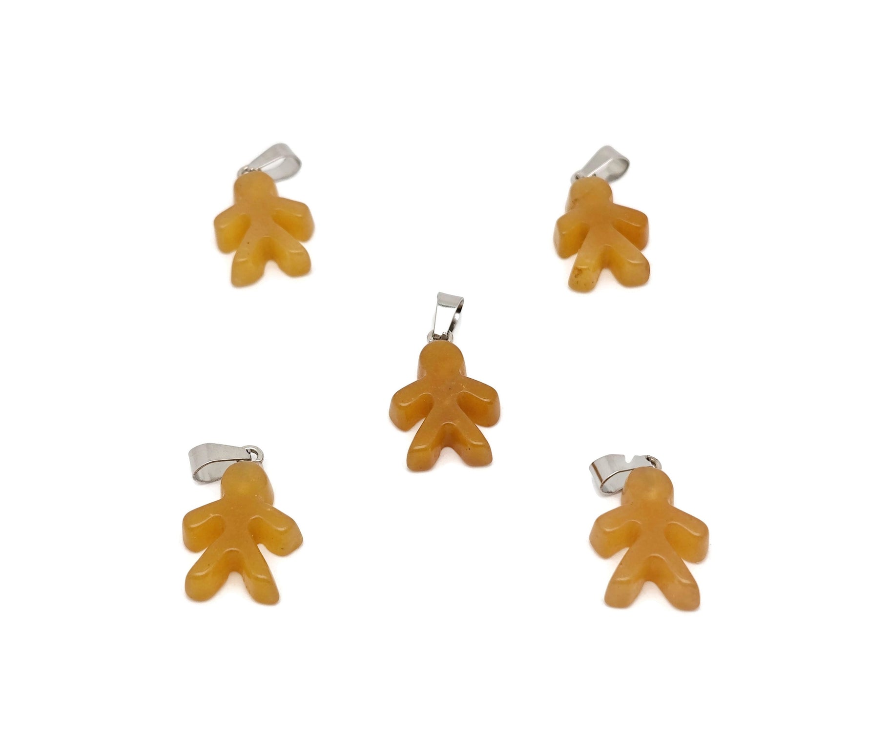Yellow jade gingerbread cookie-shaped crystal pendant from GemstoneGO, featuring mineral specimen details on a string necklace.