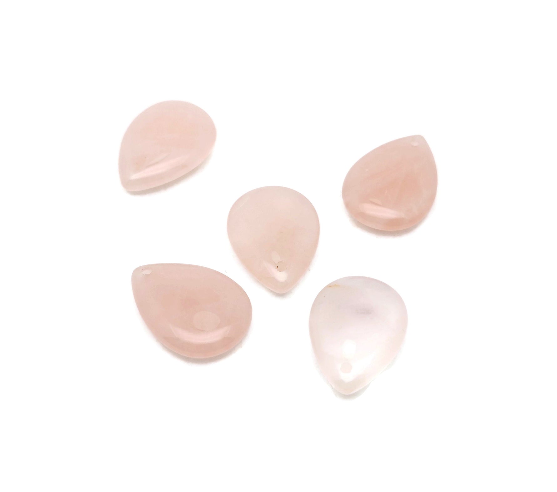 Dainty rose quartz crystal pendant for jewelry making, featuring a teardrop shape and silver bail, ideal for DIY jewelry projects.