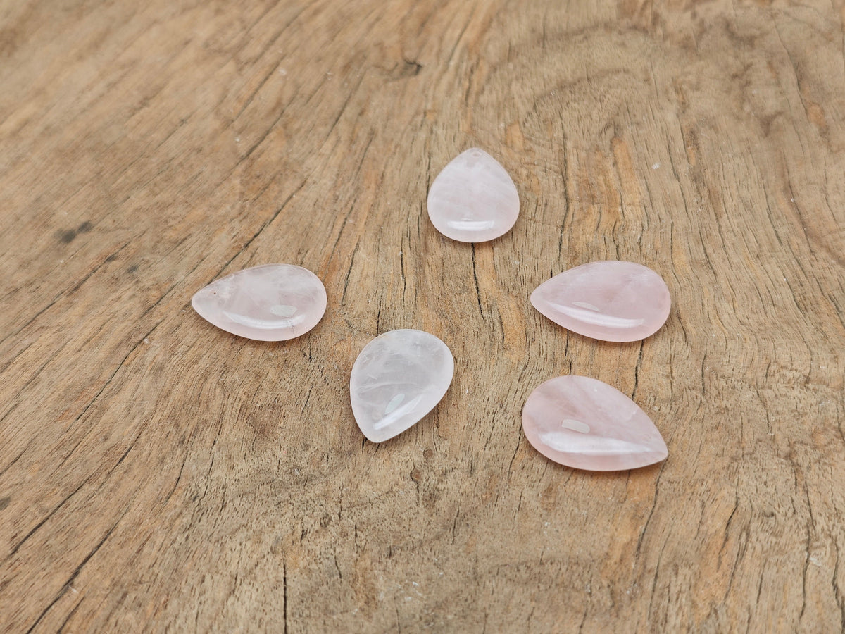 Dainty rose quartz crystal pendant for DIY jewelry making, featuring a teardrop shape and silver-tone bail by GemstoneGO.