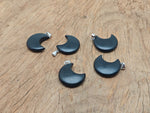Obsidian Moon gemstone pendant featuring a crescent moon design from GemstoneGO, showcasing a polished black stone pendant.