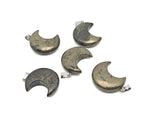 Pyrite moon gemstone pendant featuring a crescent moon design, showcasing a shiny, metallic mineral on a delicate chain.