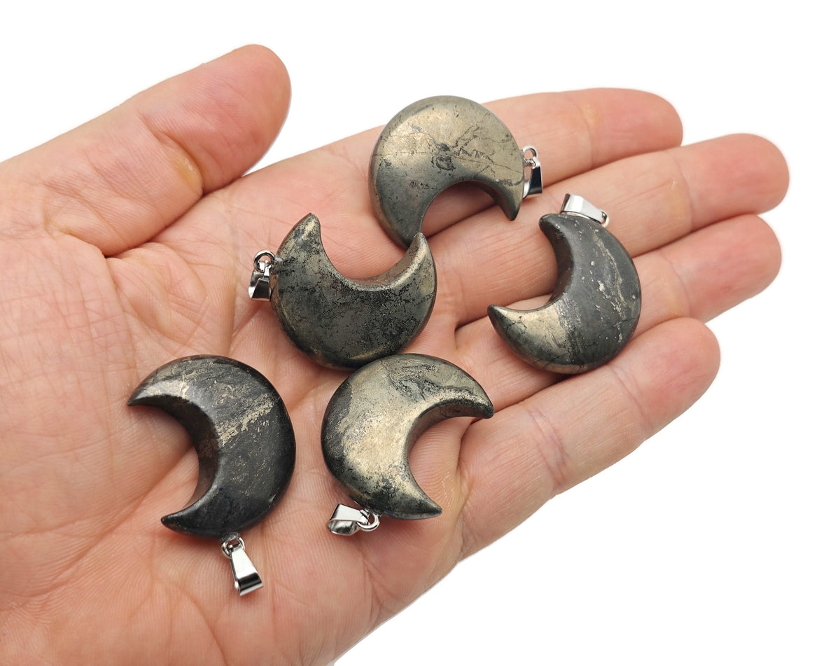 Pyrite moon gemstone pendant featuring a crescent moon design from GemstoneGO, showcasing a shiny, metallic mineral pendant.