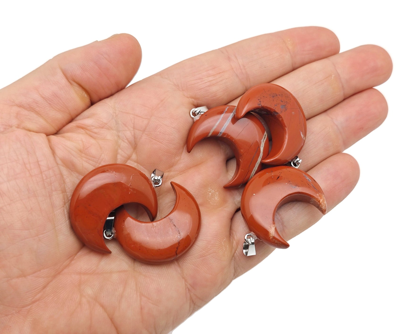 Red Jasper Moon gemstone pendant featuring a crescent moon design by GemstoneGO, showcasing vibrant red and natural stone details.