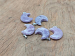 Lepidolite moon gemstone pendant featuring a crescent moon design from GemstoneGO, showcasing purple lepidolite stone and silver setting.