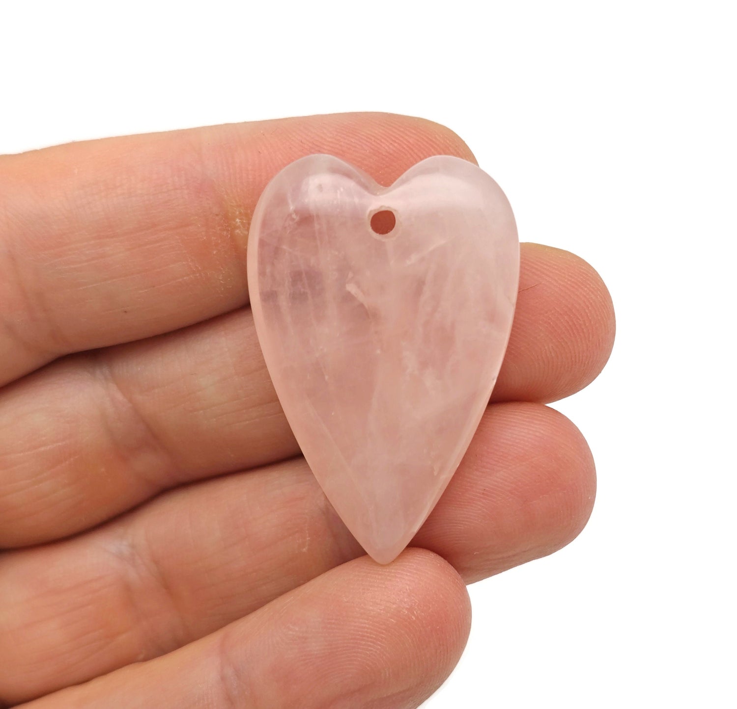 Rose quartz long heart-shaped pendant from GemstoneGO featuring a healing gemstone crystal with a silver chain.
