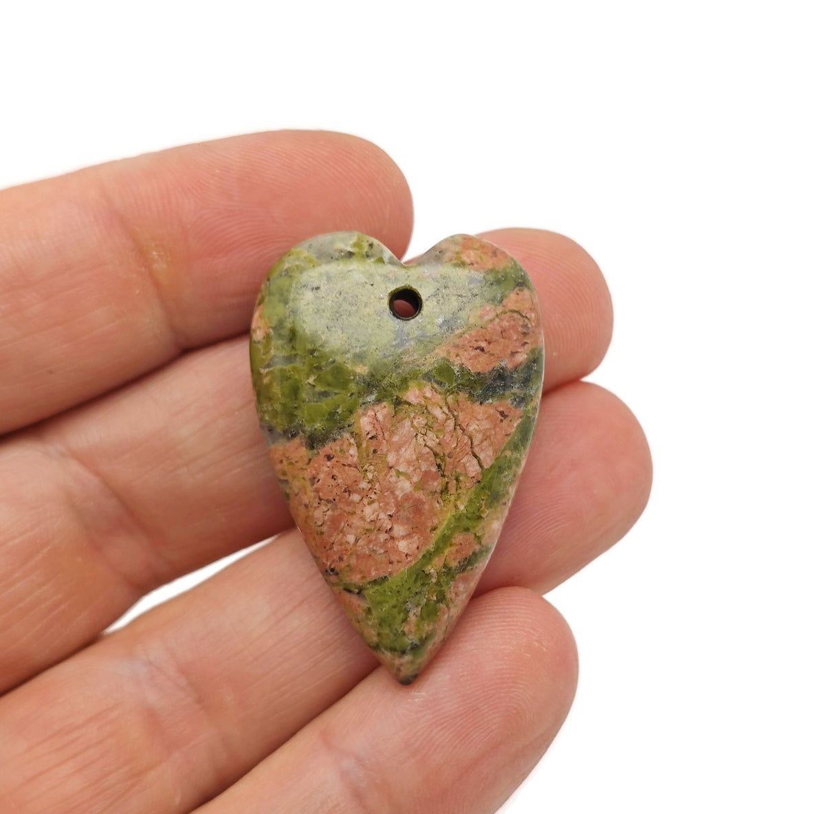 Heart-shaped Unakite love crystal pendant with a polished gemstone, showcasing vibrant green and pink hues, from GemstoneGO.