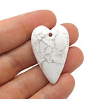 Heart-shaped Howlite love crystal pendant with a polished smooth surface, perfect for healing and jewelry wearing.