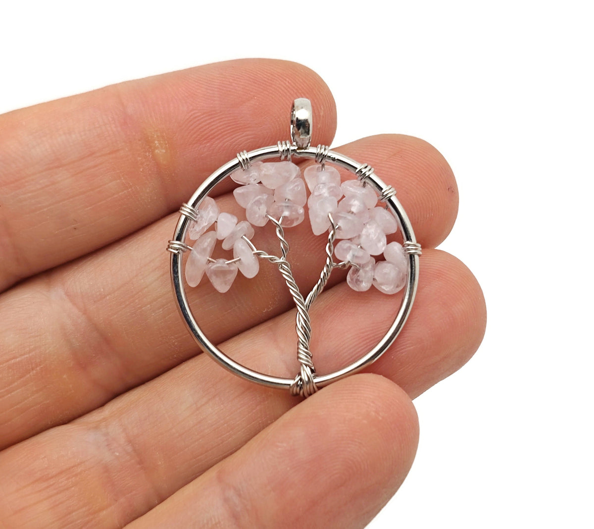 Rose Quartz Tree of Life gemstone pendant from GemstoneGO, featuring a detailed wire-wrapped crystal tree design.