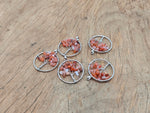Carnelian Tree of Life gemstone pendant with intricate design, featuring vibrant orange-red carnelian stones and detailed metalwork.