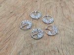 Clear quartz Tree of Life gemstone pendant with intricate wire wrapping, showcasing natural crystal and detailed craftsmanship.