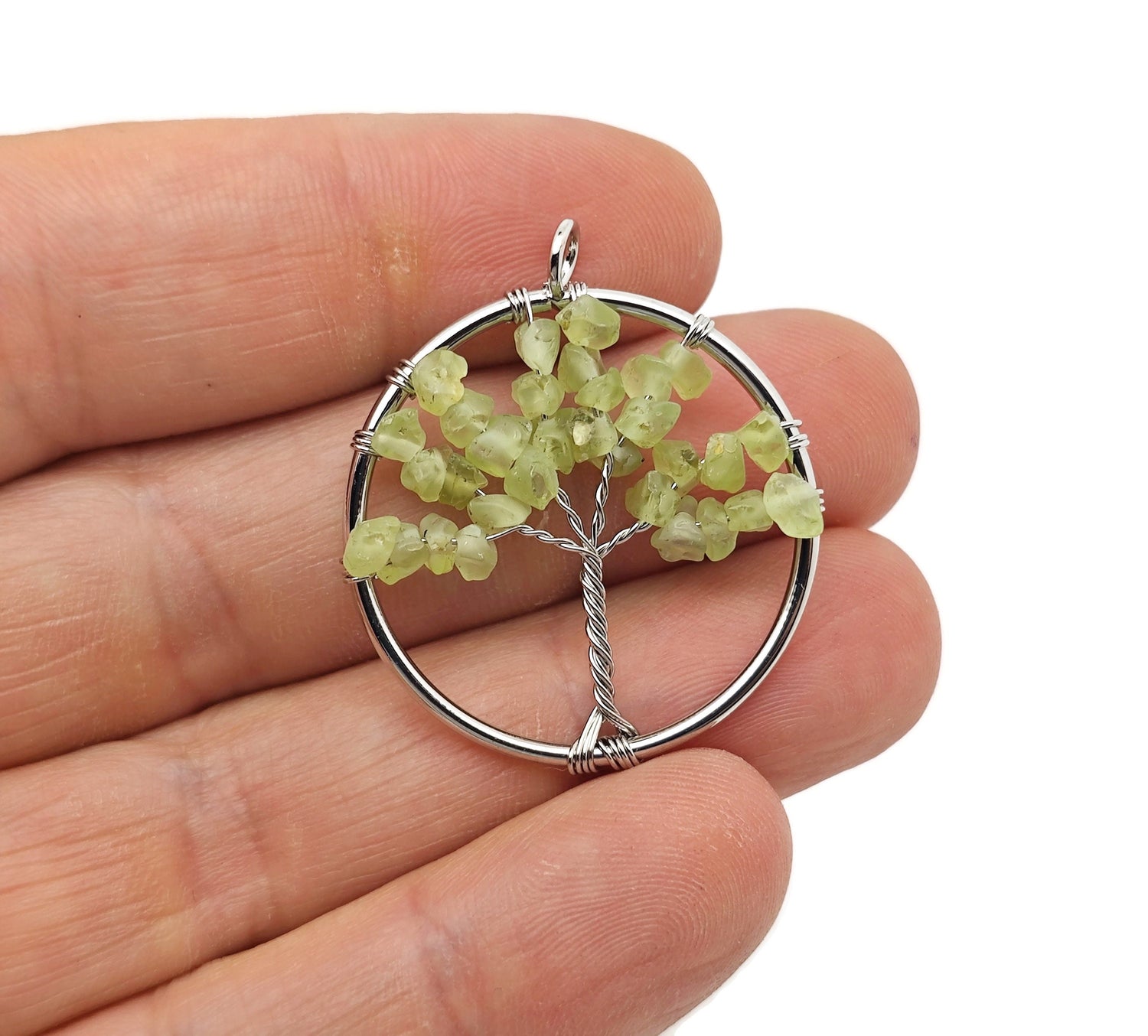 Peridot Olive Tree of Life gemstone pendant by GemstoneGO, featuring a green crystal design with detailed tree and olive leaf motifs.