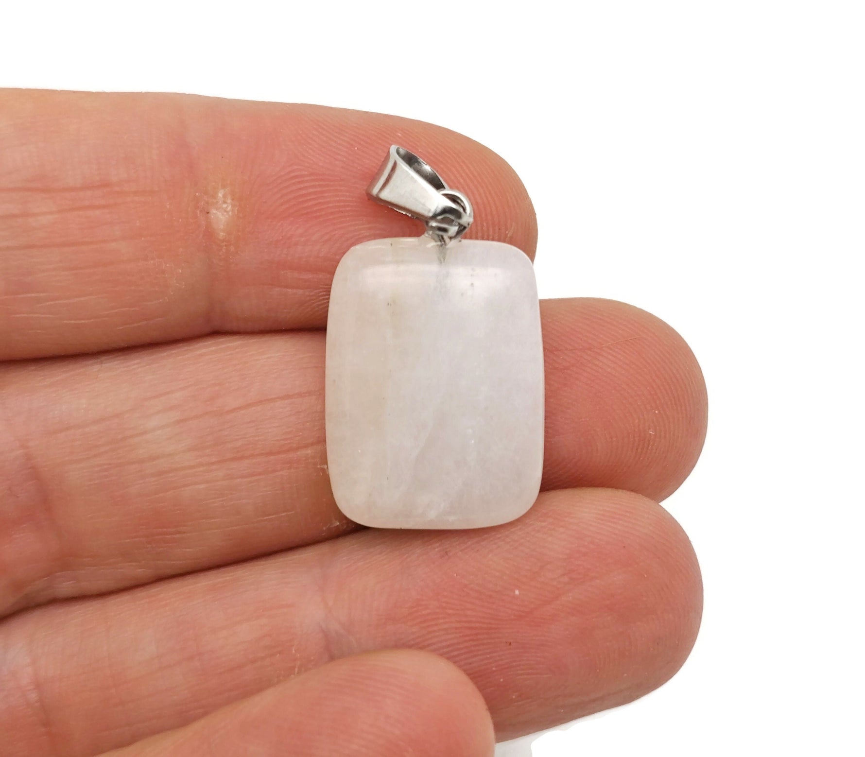 Clear quartz rectangle-shaped crystal pendant from GemstoneGO, showcasing a polished, transparent gemstone on a simple setting.