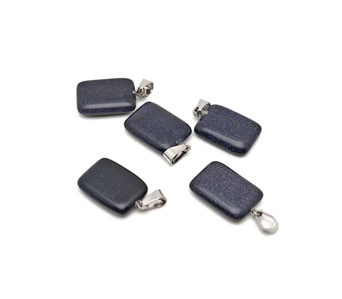 Blue Goldstone rectangle-shaped crystal pendant from GemstoneGO, showcasing a shimmering blue and gold stone on a silver setting.