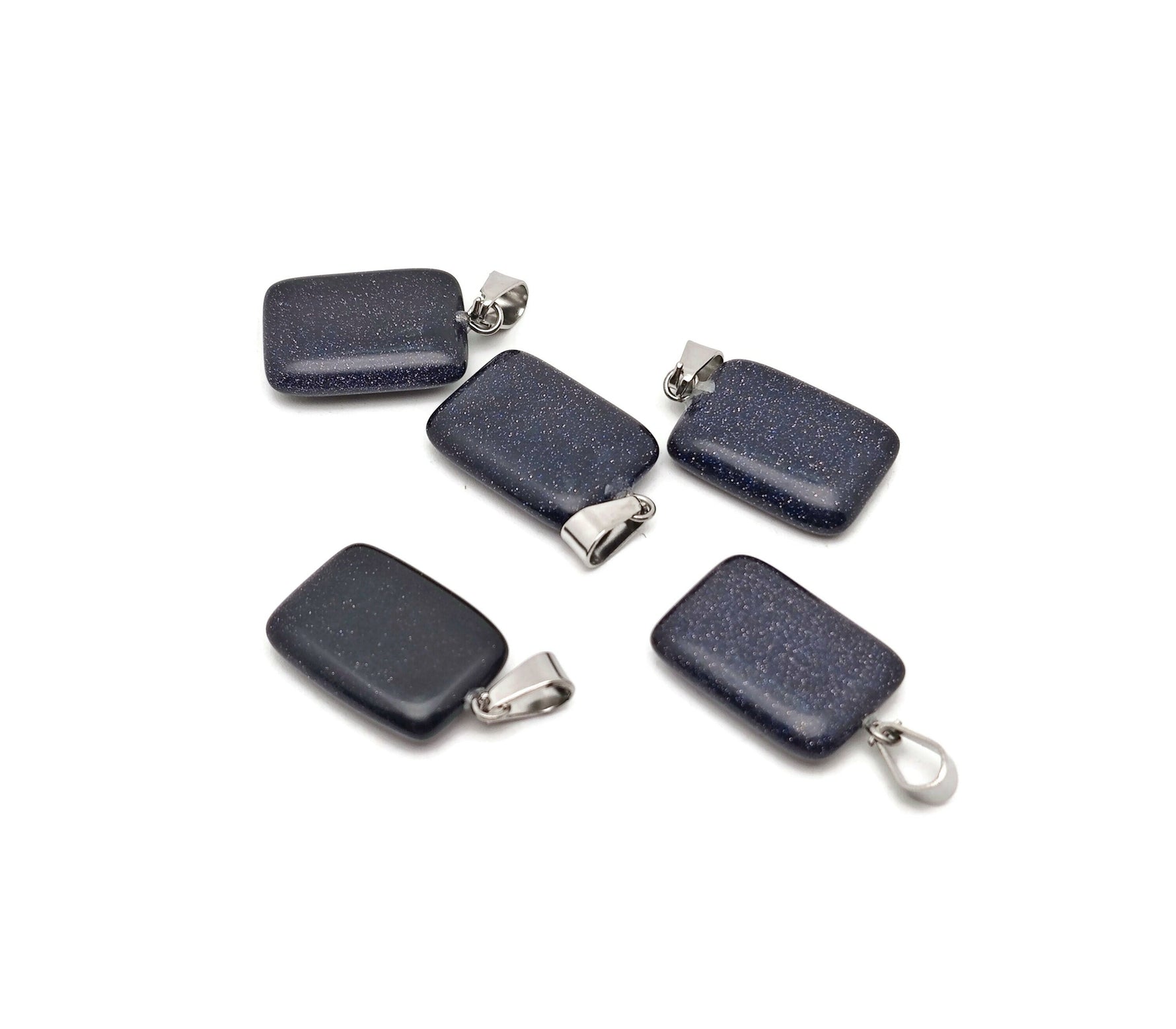 Blue Goldstone rectangle-shaped crystal pendant from GemstoneGO, showcasing a shimmering blue and gold stone on a silver setting.