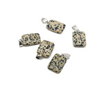 Dalmatian Jasper rectangle crystal pendant from GemstoneGO, showcasing black and cream spotted gemstone with polished finish.