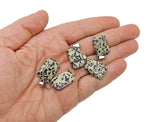 Dalmatian Jasper rectangle-shaped crystal pendant from GemstoneGO, featuring black and cream spotted pattern, wholesale gemstone jewelry.