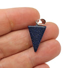 Blue Goldstone triangle-shaped crystal pendant from GemstoneGO, showcasing its sparkling, deep blue and gold flecked surface.