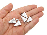 Howlite triangle crystal pendant from GemstoneGO, showcasing a smooth white gemstone with gray veining on a black background.