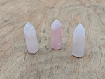 Rose quartz obelisk tower crystal, 40mm gemstone with pink translucent appearance, from GemstoneGO.