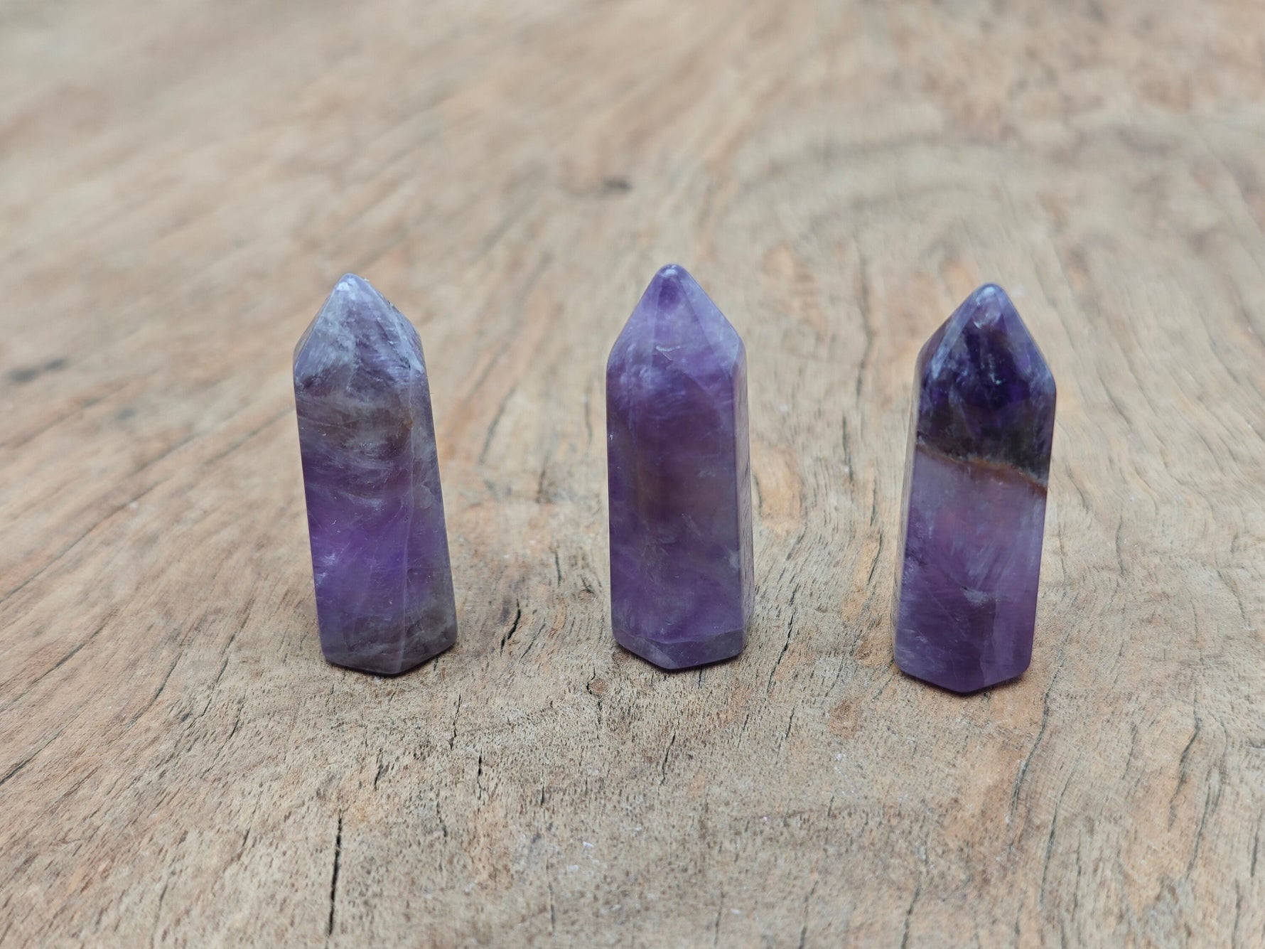 Amethyst obelisk tower crystal, 40mm, from GemstoneGO, showing purple quartz with smooth polished facets and natural crystal points.
