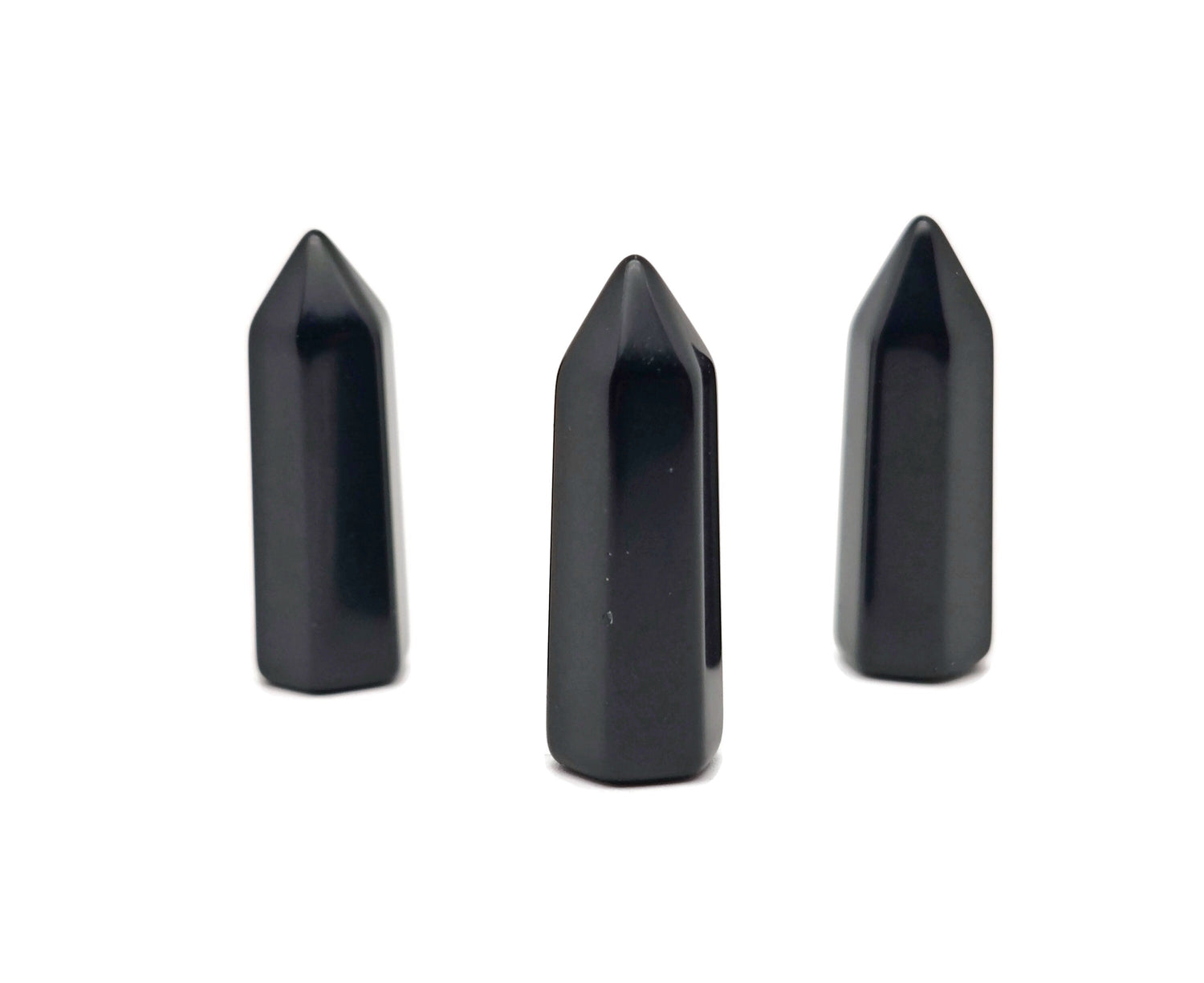 Polished 40mm Obsidian Obelisk Tower crystal from GemstoneGO, with smooth black surface and pointed top, on a neutral background.