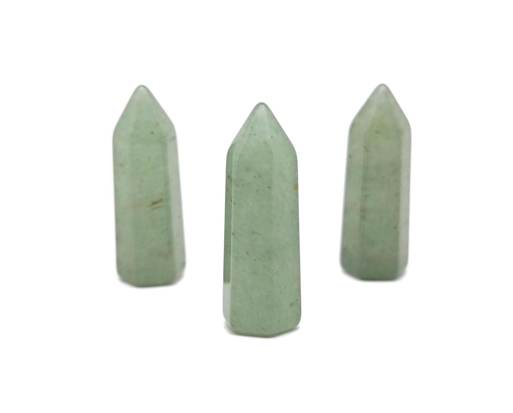 Aventurine obelisk tower crystal from GemstoneGO, 40mm tall, with green and sparkling gemstone features on a neutral background.