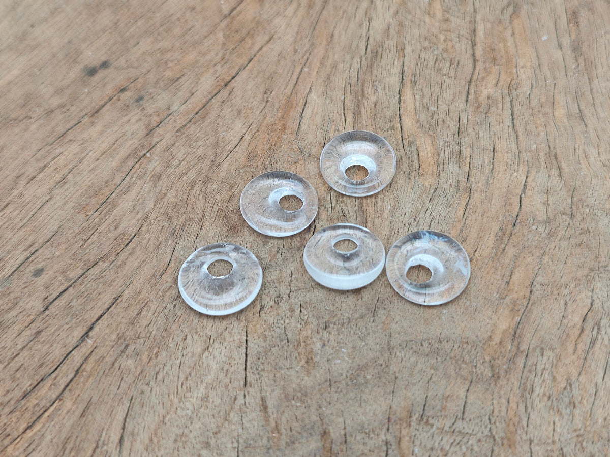 Clear quartz crystal donut pendant, 18mm Pi stone by GemstoneGO, showcasing a polished, transparent gemstone with a smooth, rounded shape.