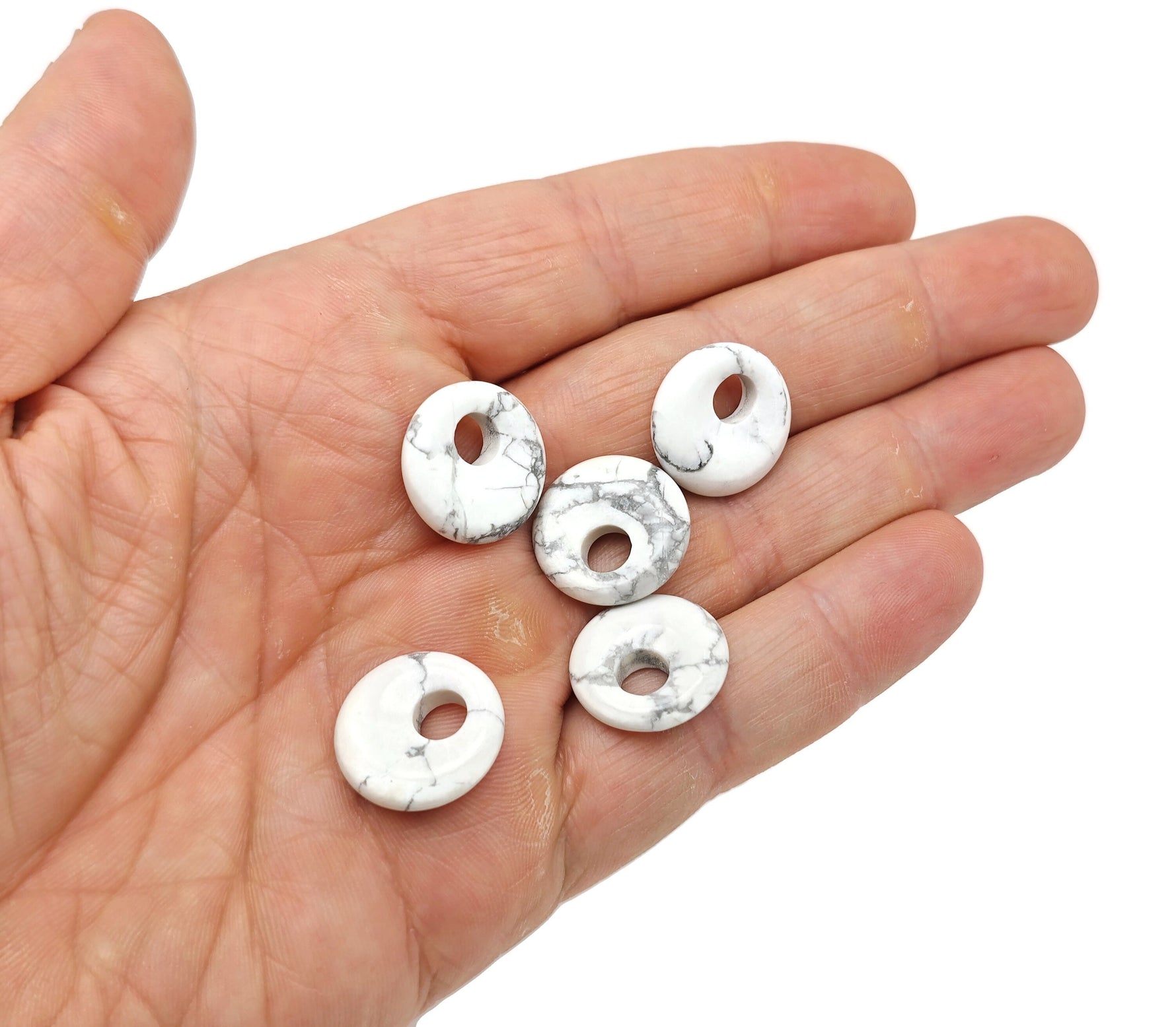 Howlite crystal donut pendant, 18mm Pi stone by GemstoneGO, featuring a smooth, polished white stone with subtle gray veining.