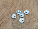 Howlite crystal donut pendant from GemstoneGO, 18mm Pi Stone with white and gray marbled appearance.