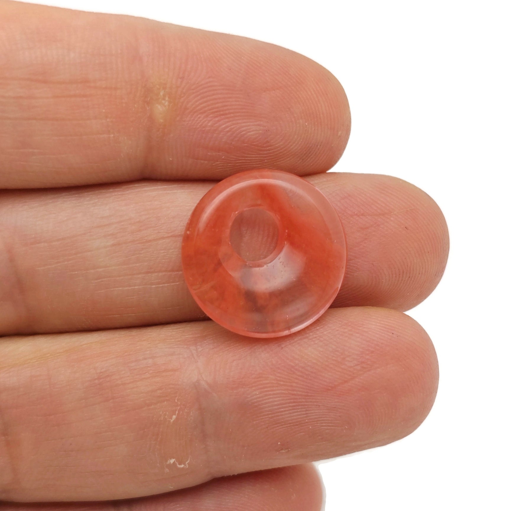 Cherry Quartz crystal donut pendant with Pi Stone design, 18mm size, from GemstoneGO, featuring a polished cherry red gemstone.