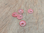 Cherry quartz crystal donut pendant from GemstoneGO, 18mm Pi stone with vibrant red color and smooth, polished surface.