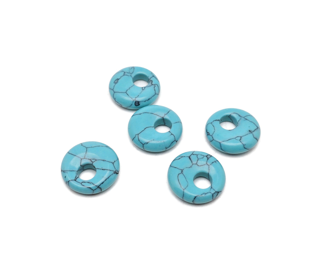 Turquoise crystal donut pendant with Pi stone design, 18mm gemstone from GemstoneGO, showcasing a polished, round gemstone.