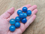 Blue agate gemstone sphere, 20mm crystal ball from GemstoneGO, smooth polished blue stone with natural banding and vibrant color.