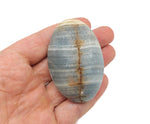 Blue onyx palm gemstone spa stone from GemstoneGO, smooth polished natural stone for relaxation and massage.