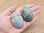 Blue onyx palm gemstone spa stone from GemstoneGO, smooth polished stone ideal for relaxation and massage therapy.